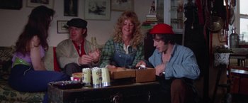 Movie still from “Scarecrow” (1973), directed by Jerry Schatzberg – A group of people sitting around a table; Medium shot, High angle