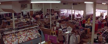 Movie still from “Scarecrow” (1973), directed by Jerry Schatzberg – A store filled with lots and lots of clothes; Extreme Wide shot, High angle