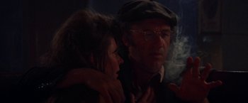 Movie still from “Scarecrow” (1973), directed by Jerry Schatzberg – A man and a woman standing next to each other; Close Up shot, Over the shoulder angle