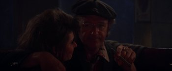 Movie still from “Scarecrow” (1973), directed by Jerry Schatzberg – An older man and a younger woman are looking at each other; Close Up shot, Over the shoulder angle