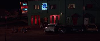Movie still from “Scarecrow” (1973), directed by Jerry Schatzberg – A car parked in front of a building at night; Extreme Wide shot, Low angle