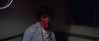 Movie still from “Scarecrow” (1973), directed by Jerry Schatzberg – A man with blood all over his face; Close Up shot, Low angle