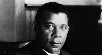 Movie still from “School Daze” (1988), directed by Spike Lee – An old black and white photo of an african - american man; Close Up shot, Low angle