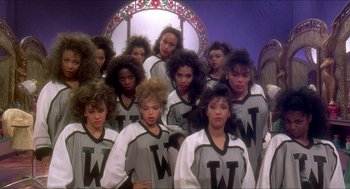 Movie still from “School Daze” (1988), directed by Spike Lee – A group of women standing next to each other; Medium shot, Low angle