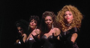 Movie still from “School Daze” (1988), directed by Spike Lee – A group of women standing next to each other; Medium shot, Low angle