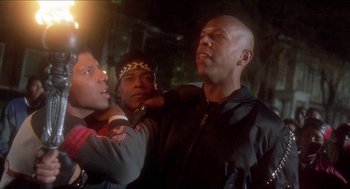 Movie still from “School Daze” (1988), directed by Spike Lee – A group of men standing next to each other; Close Up shot, Low angle