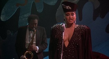 Movie still from “School Daze” (1988), directed by Spike Lee – A man and a woman are singing on a stage; Medium shot, Low angle