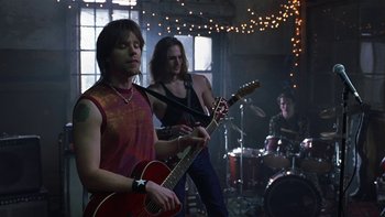 Movie still from “School of Rock” (2003), directed by Richard Linklater – A group of people that are standing up with guitars; Medium shot, Low angle