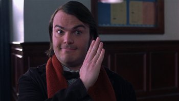 Movie still from “School of Rock” (2003), directed by Richard Linklater – A man with his hand up to his ear; Close Up shot, Over the shoulder angle