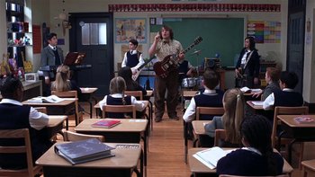 Movie still from “School of Rock” (2003), directed by Richard Linklater – A group of people in a classroom playing instruments; Wide shot, High angle
