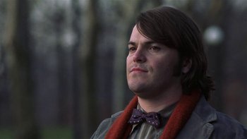 Movie still from “School of Rock” (2003), directed by Richard Linklater – A person wearing a bow tie; Close Up shot, Low angle