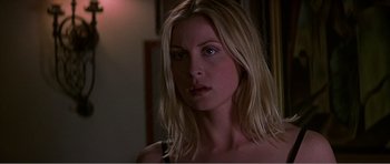 Movie still from “Scream 3” (2000), directed by Wes Craven – A woman with long blonde hair stares into the camera; Close Up shot, Low angle