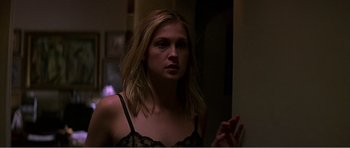 Movie still from “Scream 3” (2000), directed by Wes Craven – A woman in a black bra looking at the camera; Close Up shot, Low angle