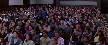 Movie still from “Scream 3” (2000), directed by Wes Craven – A large group of people sitting in a room; Wide shot, High angle