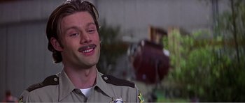 Movie still from “Scream 3” (2000), directed by Wes Craven – A person wearing a uniform; Close Up shot, Low angle