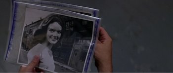 Movie still from “Scream 3” (2000), directed by Wes Craven – A person holding up a picture of a woman; Extreme Close Up shot, High angle