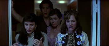 Movie still from “Scream 3” (2000), directed by Wes Craven – A group of people standing next to each other in a room; Close Up shot, High angle