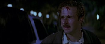 Movie still from “Scream 3” (2000), directed by Wes Craven – A man with blood all over his face and head; Close Up shot, Low angle