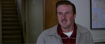 Movie still from “Scream 3” (2000), directed by Wes Craven – A person wearing a jacket with blood on his face; Close Up shot, Low angle