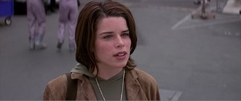 Movie still from “Scream 3” (2000), directed by Wes Craven – A person wearing a brown jacket; Close Up shot, Over the shoulder angle