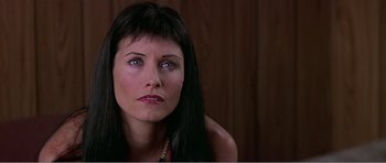 Movie still from “Scream 3” (2000), directed by Wes Craven – A person with long black hair; Close Up shot, Low angle