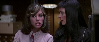 Movie still from “Scream 3” (2000), directed by Wes Craven – Two women are talking to each other in a room; Close Up shot, Low angle