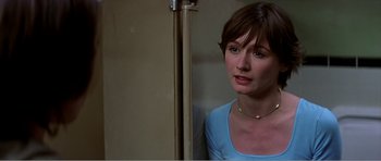 Movie still from “Scream 3” (2000), directed by Wes Craven – A person standing near a pole; Close Up shot, Over the shoulder angle