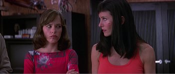 Movie still from “Scream 3” (2000), directed by Wes Craven – Two women are standing next to each other; Close Up shot, Low angle
