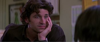 Movie still from “Scream 3” (2000), directed by Wes Craven – A person sitting with his hand on his face; Close Up shot, Over the shoulder angle