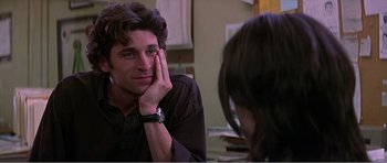 Movie still from “Scream 3” (2000), directed by Wes Craven – A man sitting in front of a woman in a room; Close Up shot, Over the shoulder angle