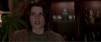 Movie still from “Scream 3” (2000), directed by Wes Craven – A woman that is looking at the camera; Close Up shot, Over the shoulder angle