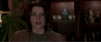 Movie still from “Scream 3” (2000), directed by Wes Craven – A person wearing a jacket; Close Up shot, Over the shoulder angle