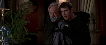 Movie still from “Scream 3” (2000), directed by Wes Craven – Two men with duct tape on their faces; Close Up shot, Over the shoulder angle