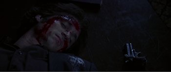 Movie still from “Scream 3” (2000), directed by Wes Craven – A person with blood on their face and head; Close Up shot, Overhead angle
