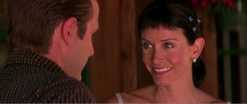 Movie still from “Scream 3” (2000), directed by Wes Craven – A man and a woman smiling at each other; Close Up shot, Over the shoulder angle