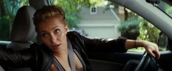 Movie still from “Scream 4” (2011), directed by Wes Craven – A woman sitting in the back seat of a car; Close Up shot, Over the shoulder angle