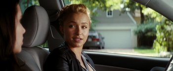 Movie still from “Scream 4” (2011), directed by Wes Craven – A woman sitting in the back seat of a car; Close Up shot, Over the shoulder angle