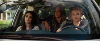 Movie still from “Scream 4” (2011), directed by Wes Craven – Two women sitting in the back seat of a car; Medium shot, Over the shoulder angle