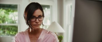 Movie still from “Scream 4” (2011), directed by Wes Craven – A person wearing glasses; Close Up shot, Over the shoulder angle