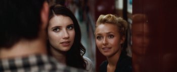 Movie still from “Scream 4” (2011), directed by Wes Craven – Two young women posing for a picture in a store; Close Up shot, Over the shoulder angle