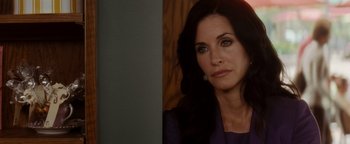 Movie still from “Scream 4” (2011), directed by Wes Craven – Courteney cox in a purple jacket looking at the camera; Close Up shot, Over the shoulder angle