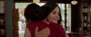 Movie still from “Scream 4” (2011), directed by Wes Craven – A woman hugging another woman in a red dress; Close Up shot, Over the shoulder angle
