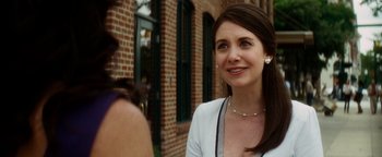 Movie still from “Scream 4” (2011), directed by Wes Craven – A woman standing next to a brick building; Close Up shot, Over the shoulder angle