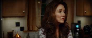 Movie still from “Scream 4” (2011), directed by Wes Craven – A person sitting in a room; Close Up shot, Over the shoulder angle