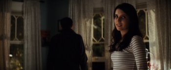 Movie still from “Scream 4” (2011), directed by Wes Craven – A man and a woman standing in front of a window at night; Close Up shot, Over the shoulder angle