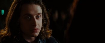 Movie still from “Scream 4” (2011), directed by Wes Craven – A person with long brown hair; Close Up shot, Over the shoulder angle
