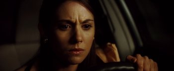 Movie still from “Scream 4” (2011), directed by Wes Craven – A person in a car; Close Up shot, High angle