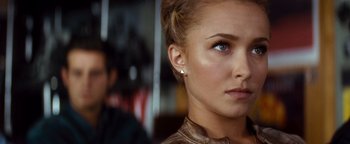 Movie still from “Scream 4” (2011), directed by Wes Craven – A woman's face and ear piercings; Close Up shot, Over the shoulder angle