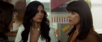 Movie still from “Scream 4” (2011), directed by Wes Craven – Two women standing next to each other in a room; Close Up shot, Over the shoulder angle