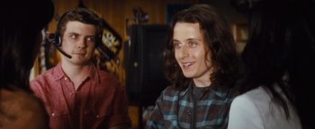 Movie still from “Scream 4” (2011), directed by Wes Craven – A man and a woman sitting next to each other in front of a microphone; Close Up shot, Over the shoulder angle